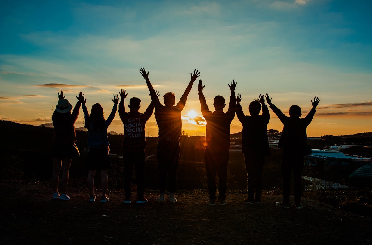 group of people at the sunset